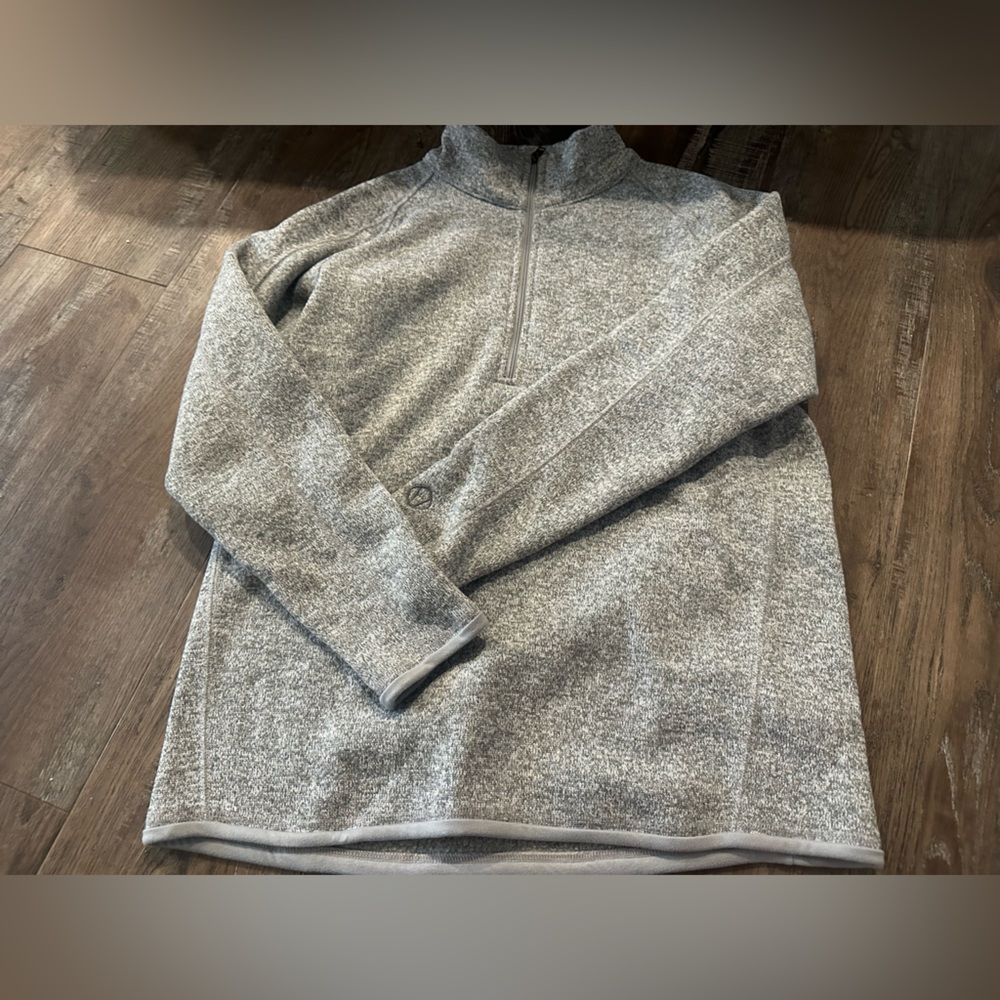 Stormpack grey zip up sweater.
